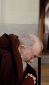 Padre Pio praying